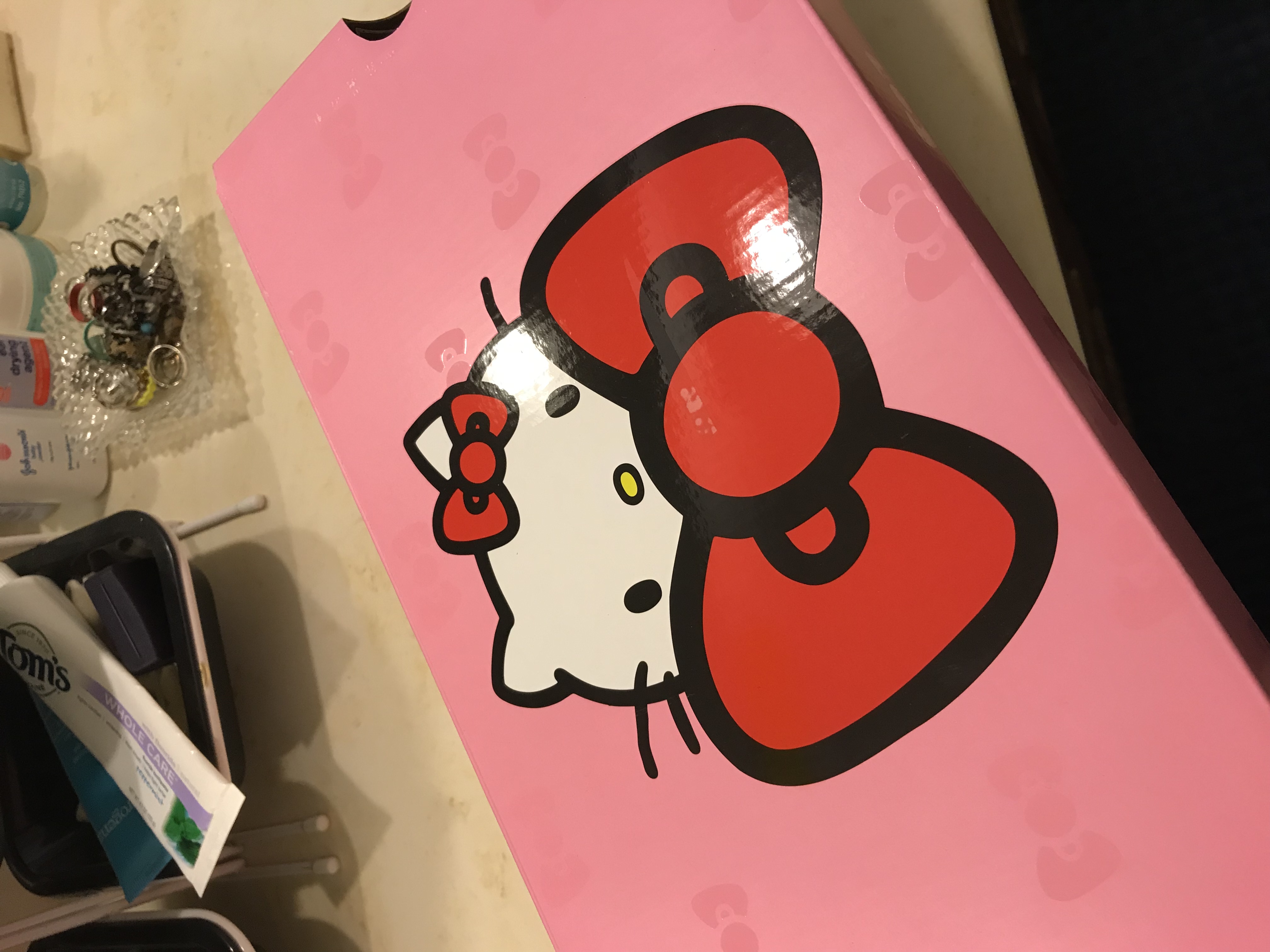 lid to box for aforementioned Converses (Hello Kitty peeking over a bow)