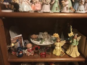 a shelf full of pretty little things, tucked in an étagère